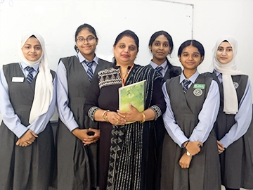 CBSE Syllabus Kuwait Indian School – ICS best secondary education Kuwait teacher with female students in uniform